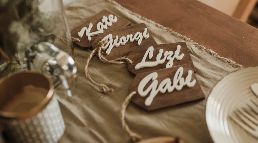 wooden name tags arranged on table during wedding ceremony